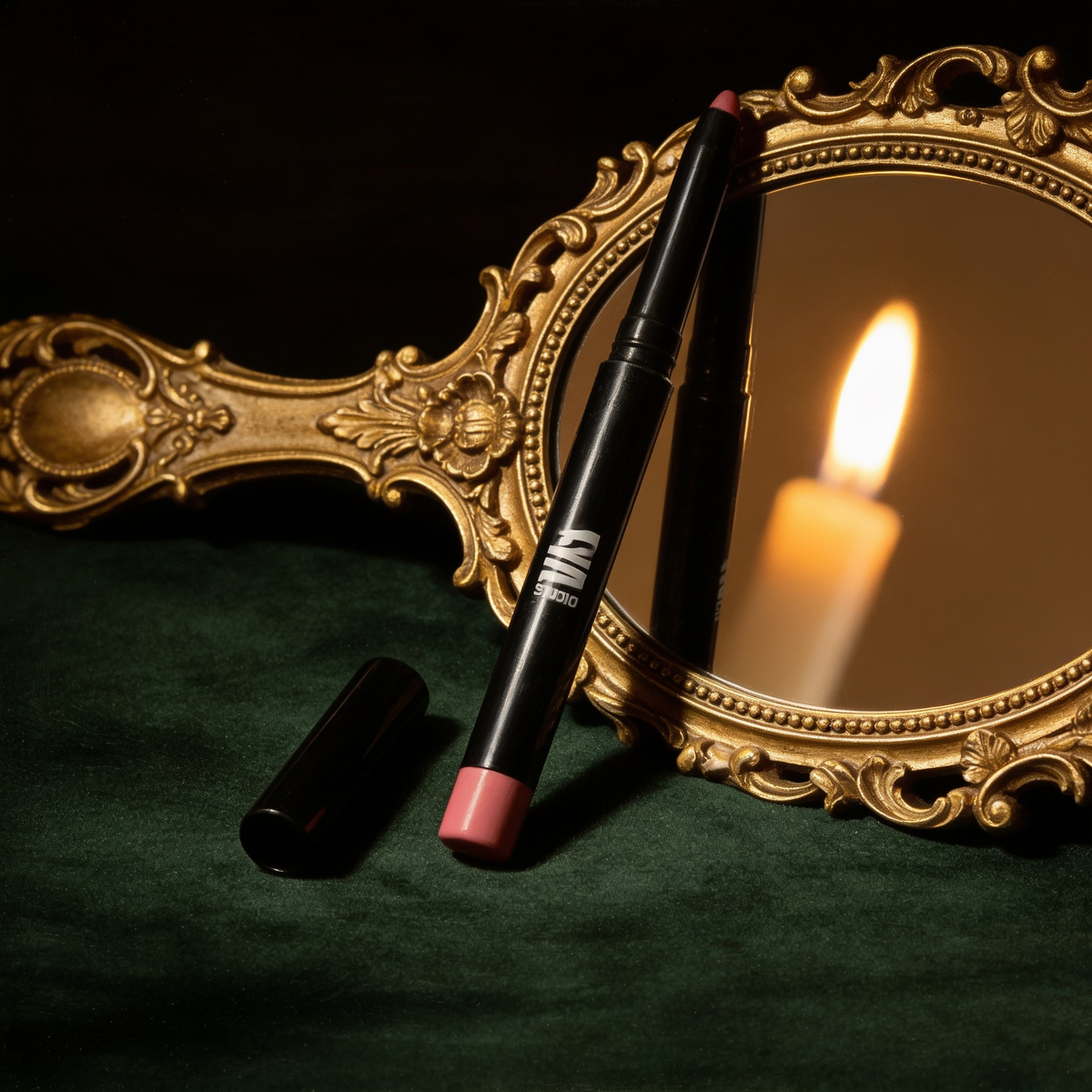 Automatic Lip Liner beside a gilded hand mirror on green velvet